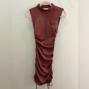 Dress pink turtle neck sleeveless. Rouging on side. MIDI